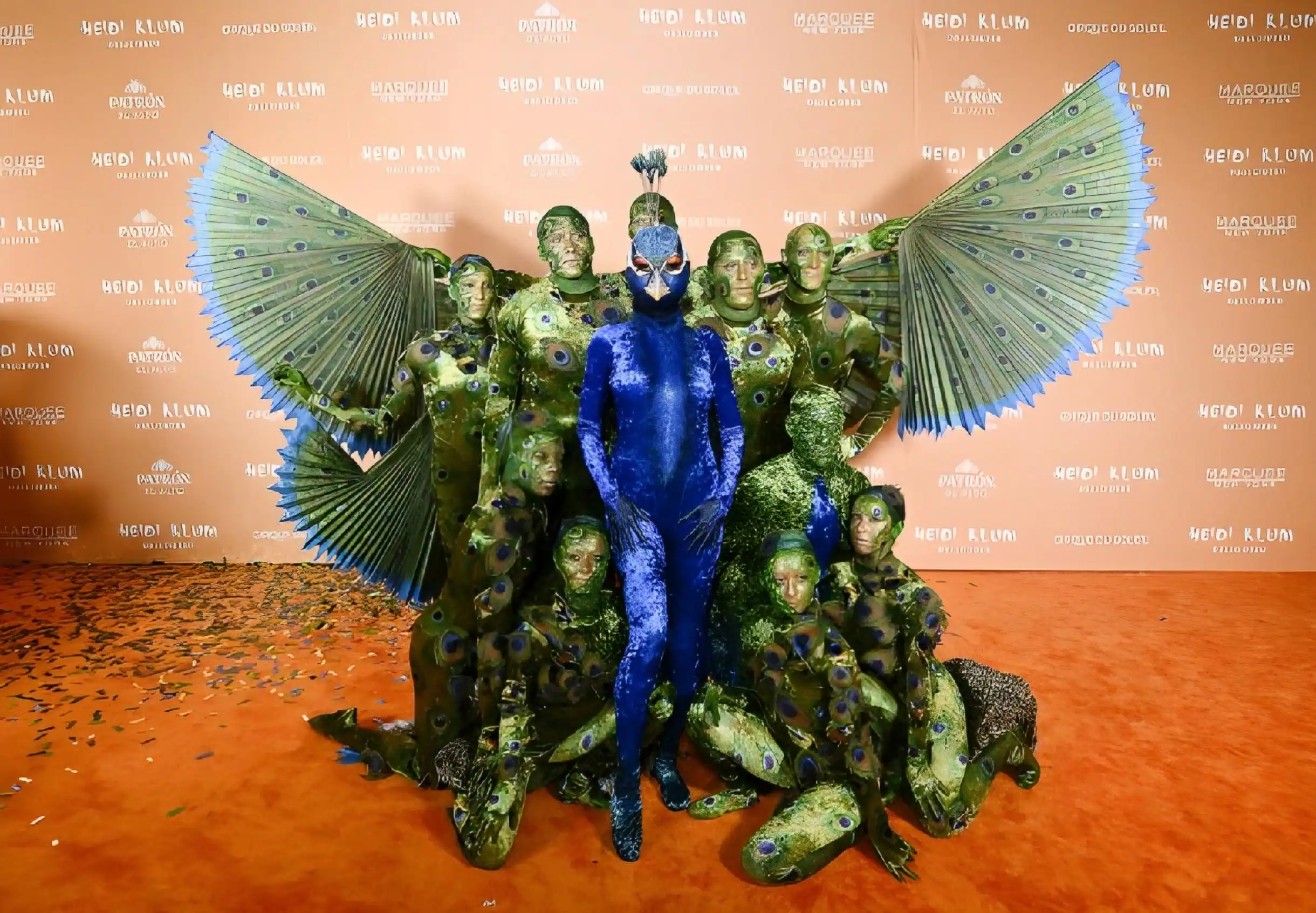Heidi Klum Celebrates Halloween as a Shimmering Peacock